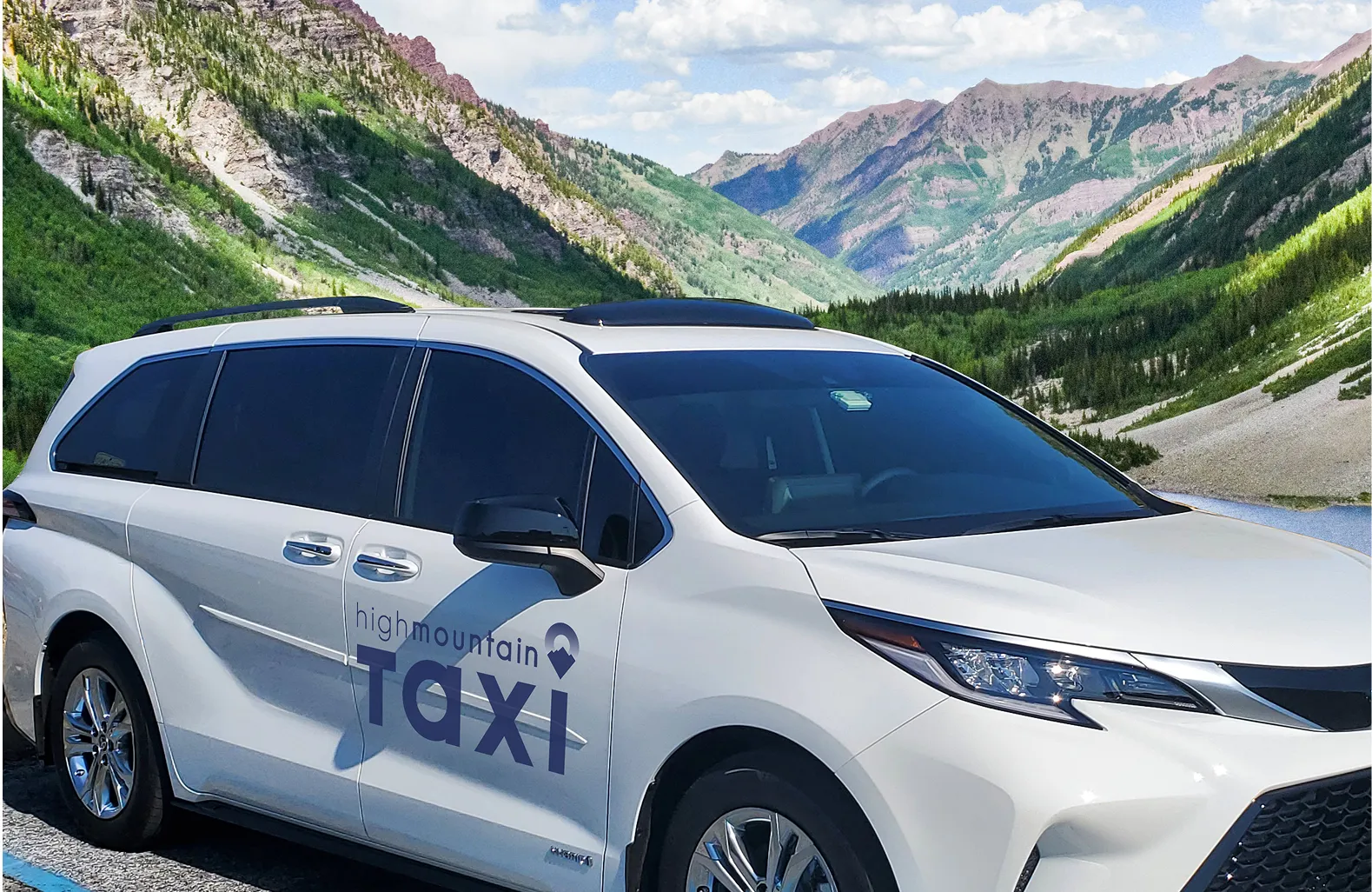 High Mountain Taxi van driving through scenic mountain road near Aspen and Vail